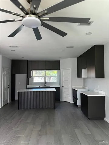 a kitchen with stainless steel appliances granite countertop a sink and cabinets