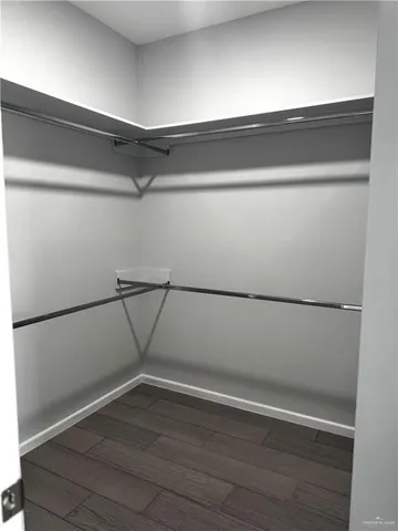 a view of an empty walk in closet