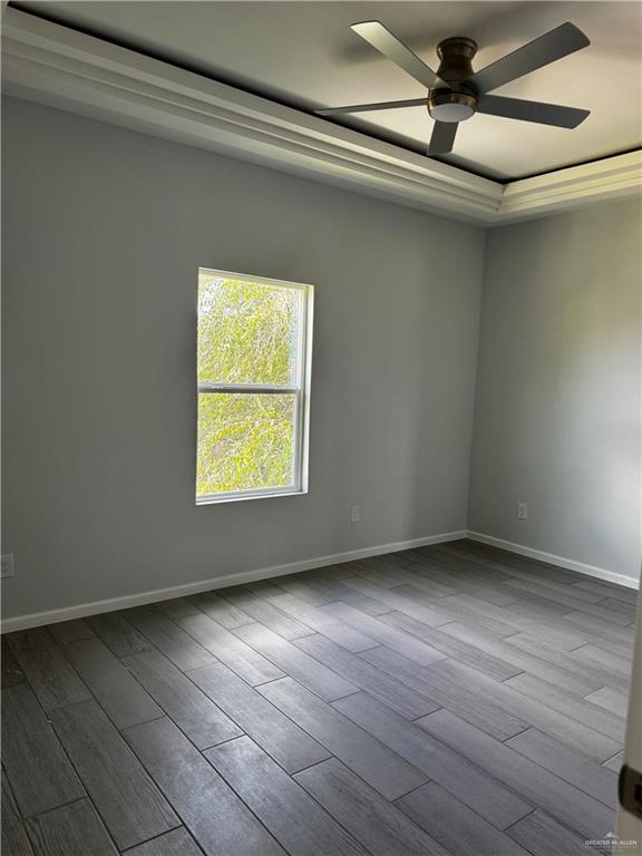 2801 Stablewood Mission, TX 78574 - Photo 10 of 18 a view of an empty room with wooden floor and a window