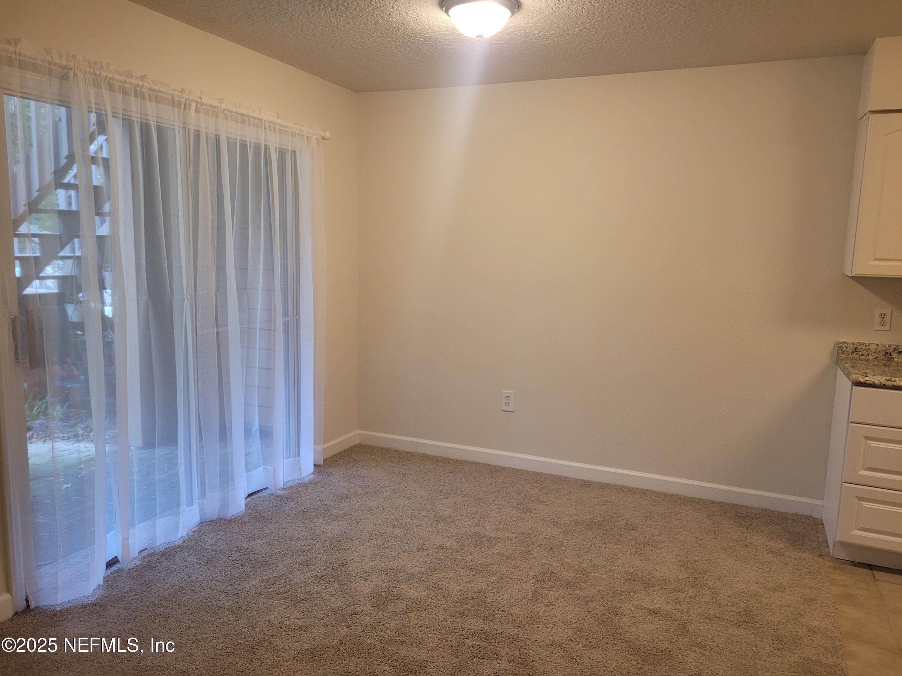 1800 Park Avenue, Unit 339 Orange Park, FL 32073 - Photo 10 of 14 a view of an empty room with entrance