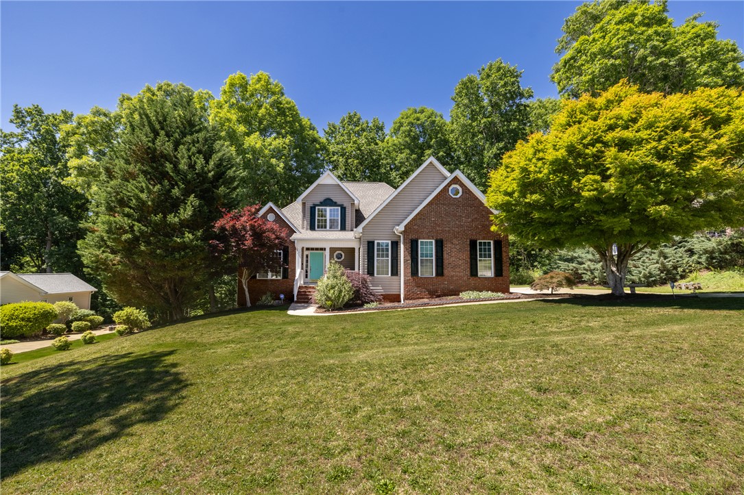 110 Brookstone Way Central, SC 29630 - Photo 41 of 46 This charming residence features a classic exterior with lush landscaping and mature trees.