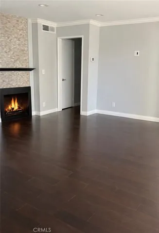 a view of room with window and wooden floor