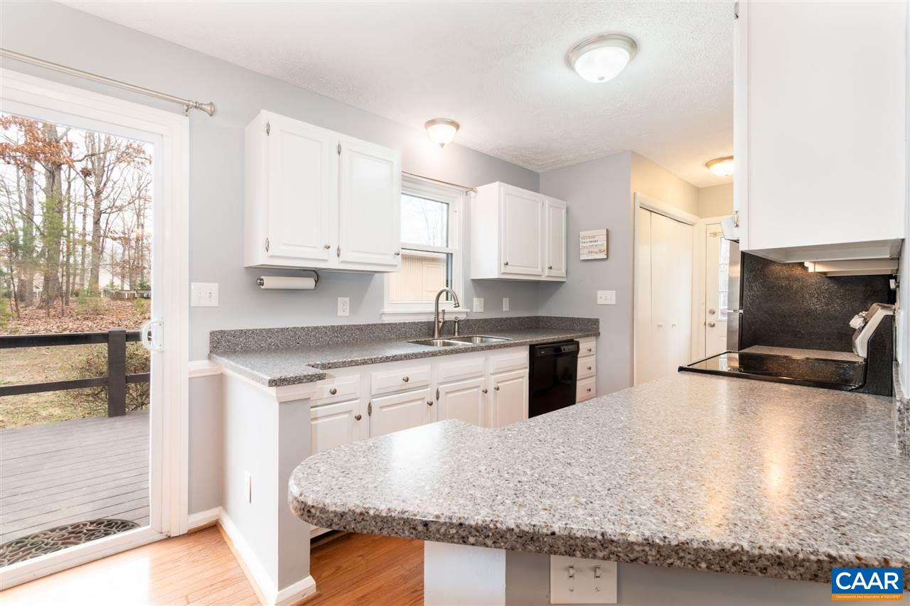 33 Oak Grove Road Palmyra, VA 22963 - Photo 11 of 42 a kitchen with stainless steel appliances granite countertop a stove a sink and a microwave