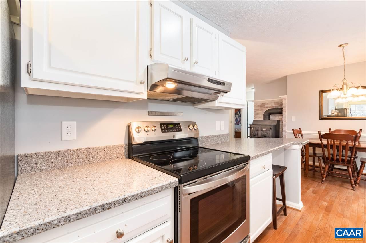 33 Oak Grove Road Palmyra, VA 22963 - Photo 14 of 42 a kitchen with stainless steel appliances granite countertop a stove a sink and a microwave