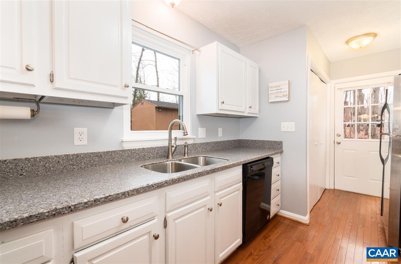 33 Oak Grove Road Palmyra, VA 22963 - Photo 15 of 42 a kitchen with granite countertop a sink a cabinets and window