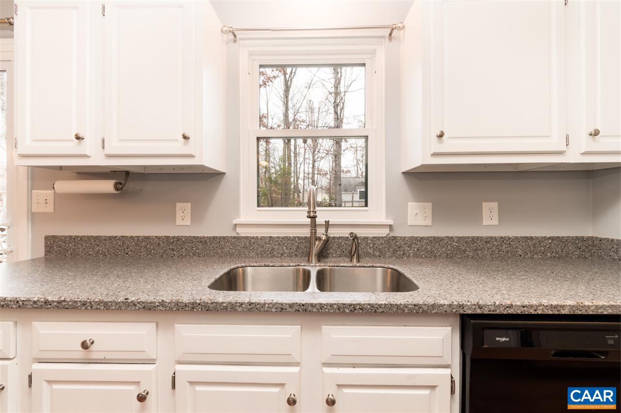 33 Oak Grove Road Palmyra, VA 22963 - Photo 16 of 42 a kitchen with granite countertop a sink and a stove