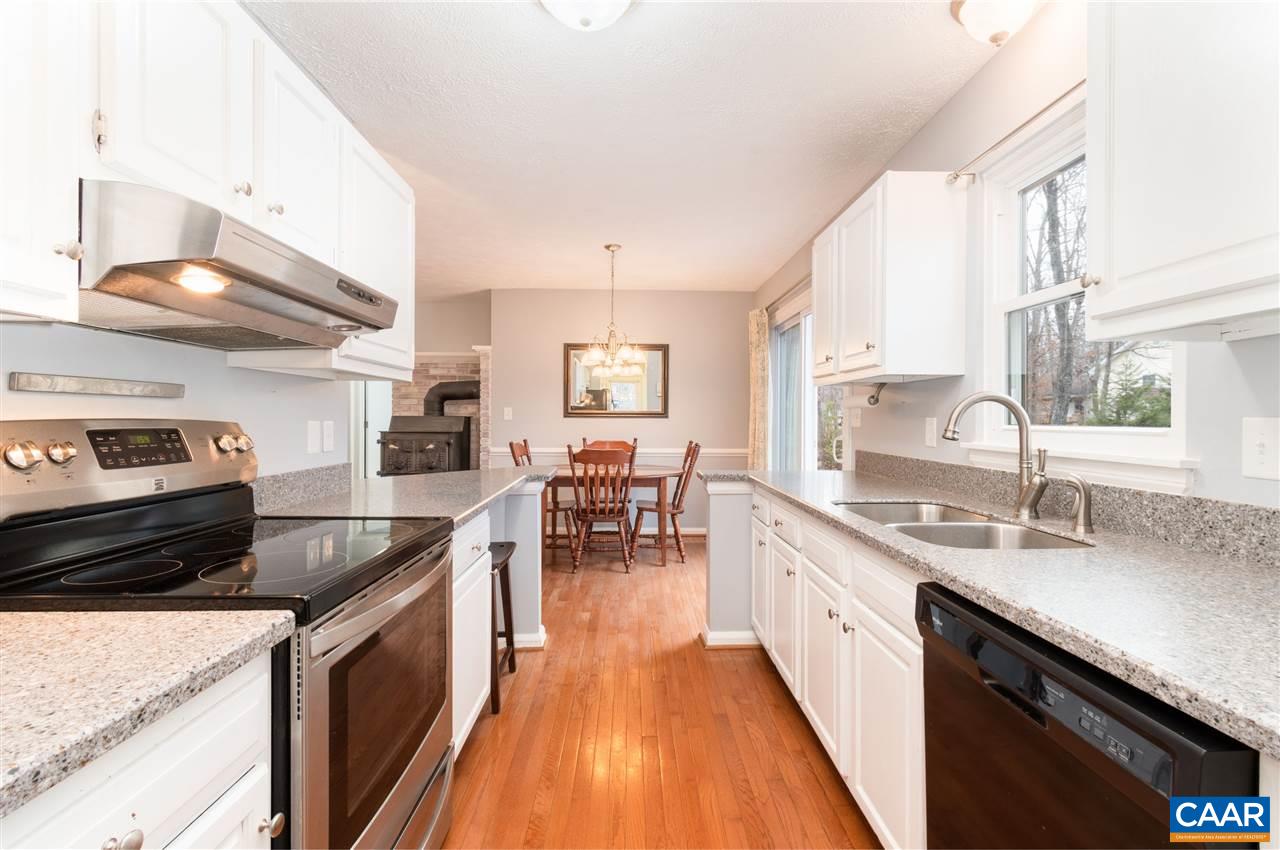 33 Oak Grove Road Palmyra, VA 22963 - Photo 2 of 42 a kitchen with stainless steel appliances granite countertop a sink stove and cabinets