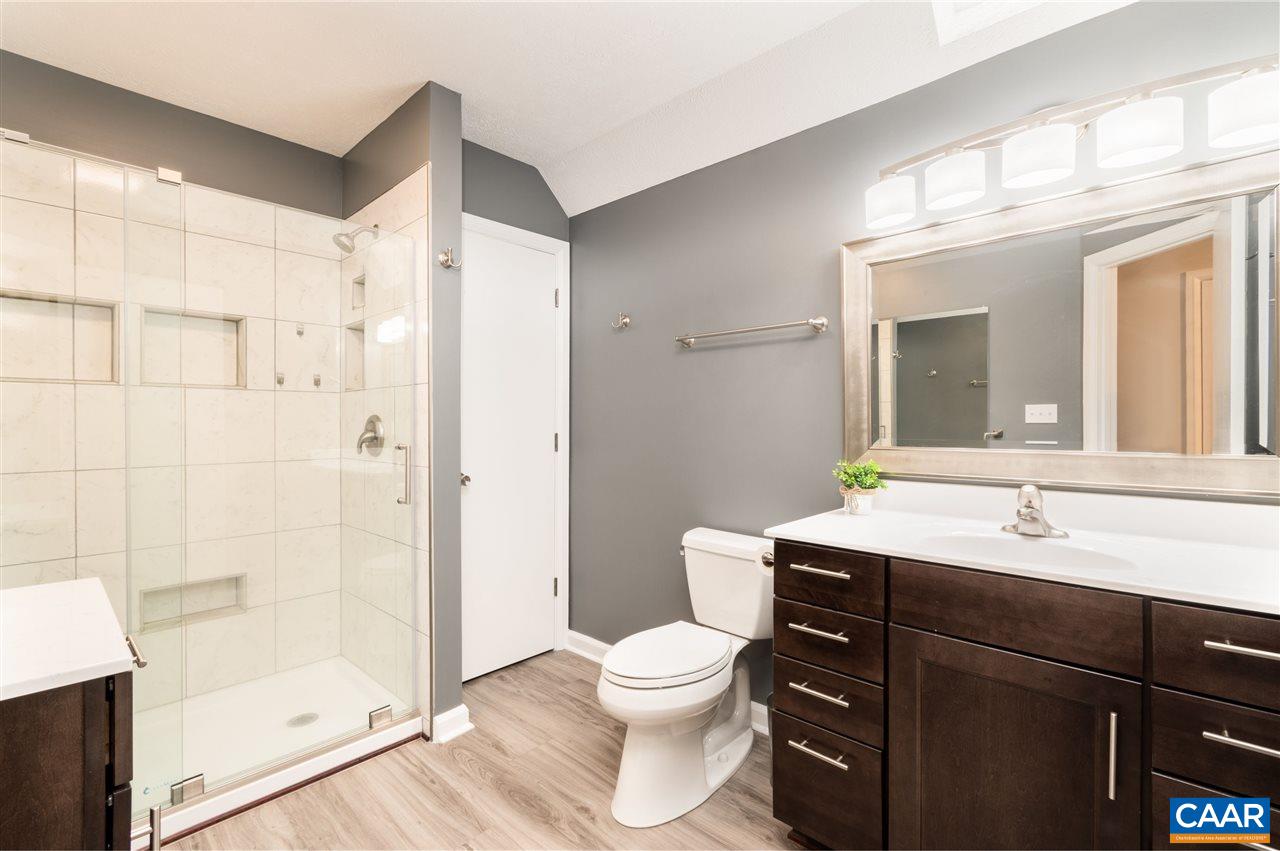 33 Oak Grove Road Palmyra, VA 22963 - Photo 24 of 42 a bathroom with a toilet a sink and a mirror