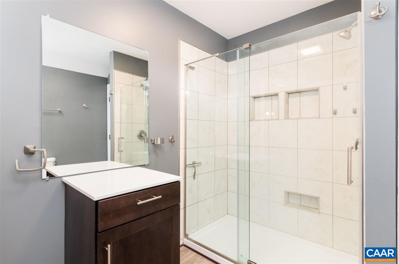 33 Oak Grove Road Palmyra, VA 22963 - Photo 25 of 42 a bathroom with a sink a toilet and shower