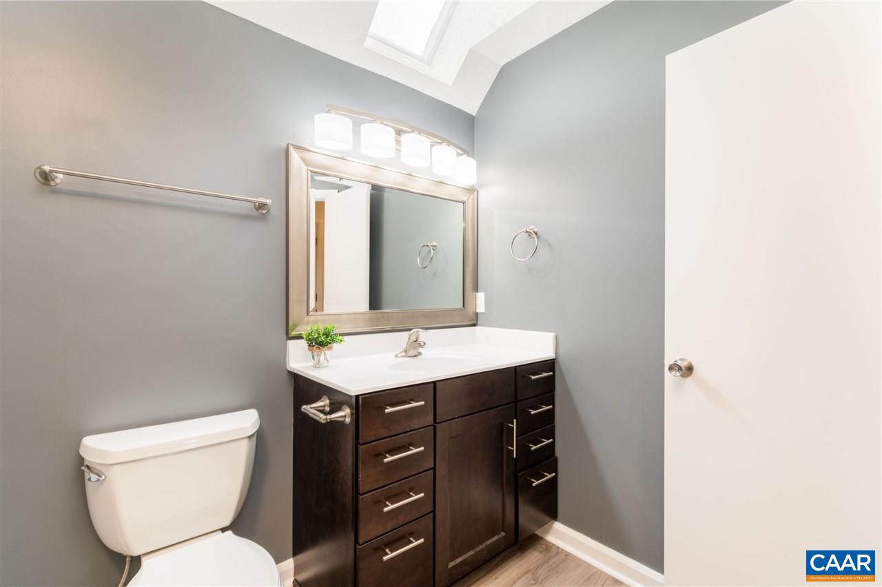 33 Oak Grove Road Palmyra, VA 22963 - Photo 26 of 42 a bathroom with a toilet a sink and mirror