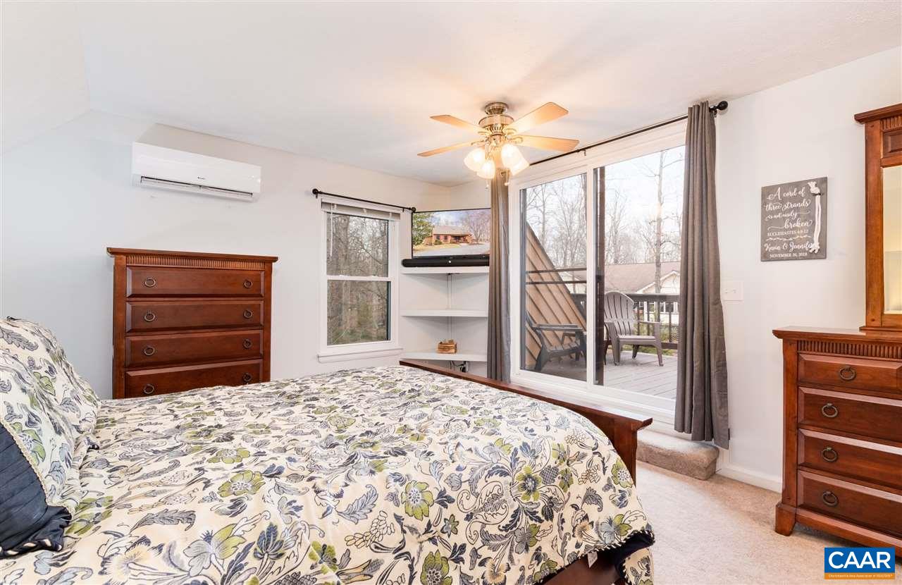 33 Oak Grove Road Palmyra, VA 22963 - Photo 28 of 42 a bedroom with a bed and a dresser