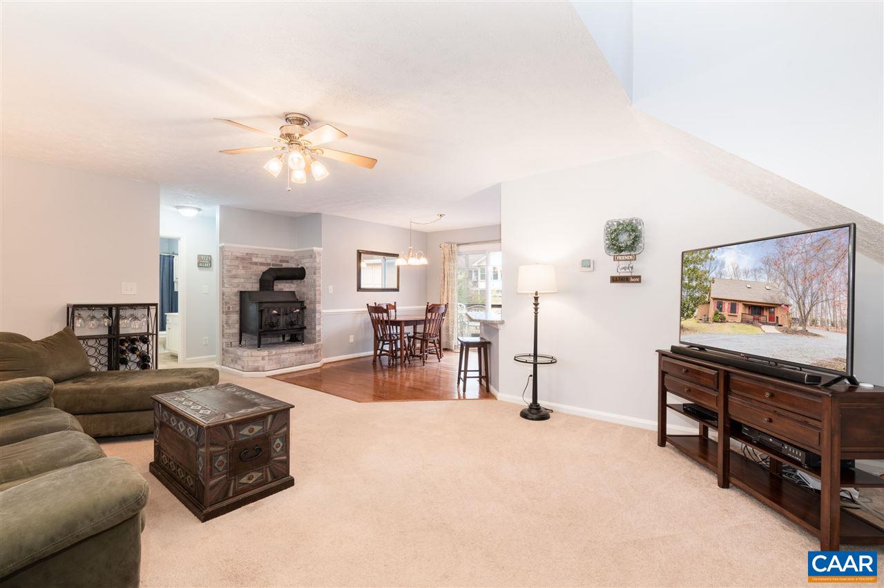 33 Oak Grove Road Palmyra, VA 22963 - Photo 9 of 42 a living room with furniture and a flat screen tv
