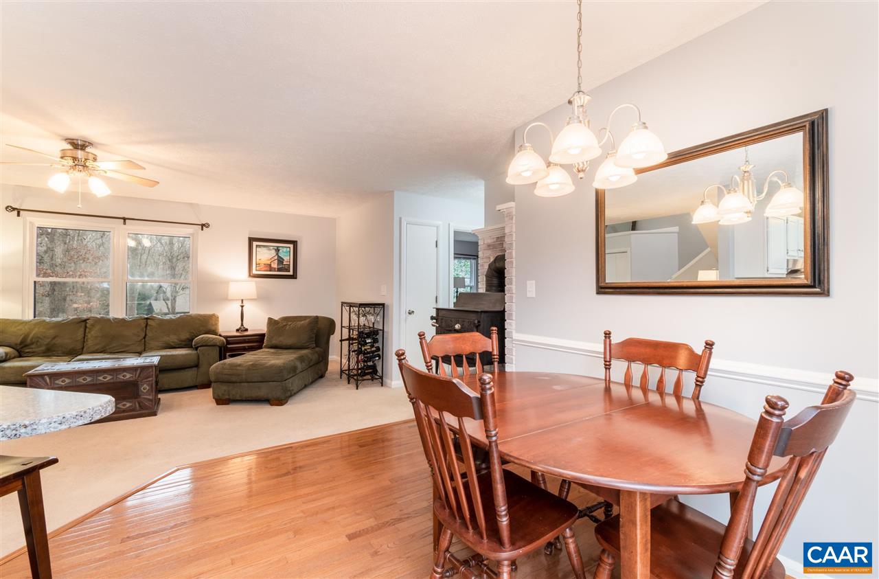 33 Oak Grove Road Palmyra, VA 22963 - Photo 10 of 42 a view of a dining room with furniture wooden floor and a chandelier