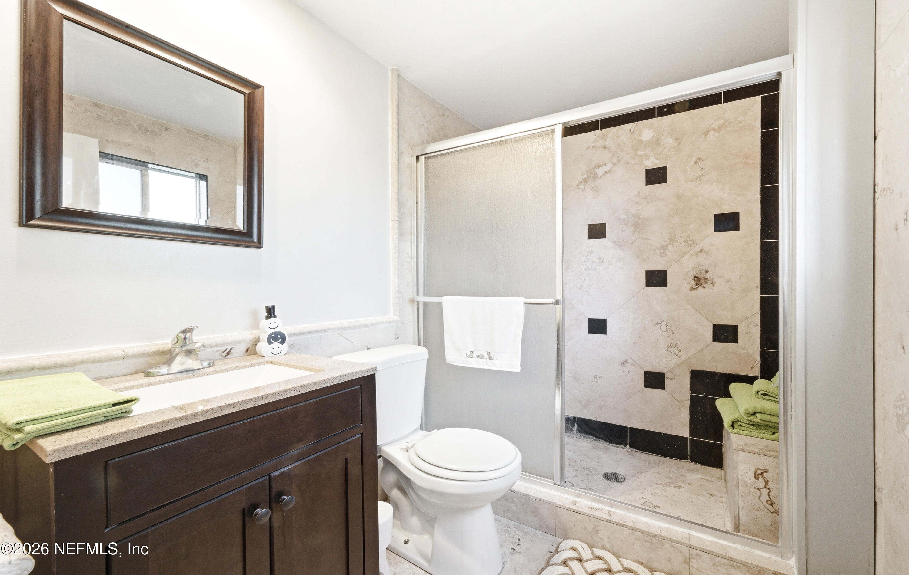 147 Knight Boxx Road Middleburg, FL 32068 - Photo 16 of 30 a bathroom with a sink a toilet and shower