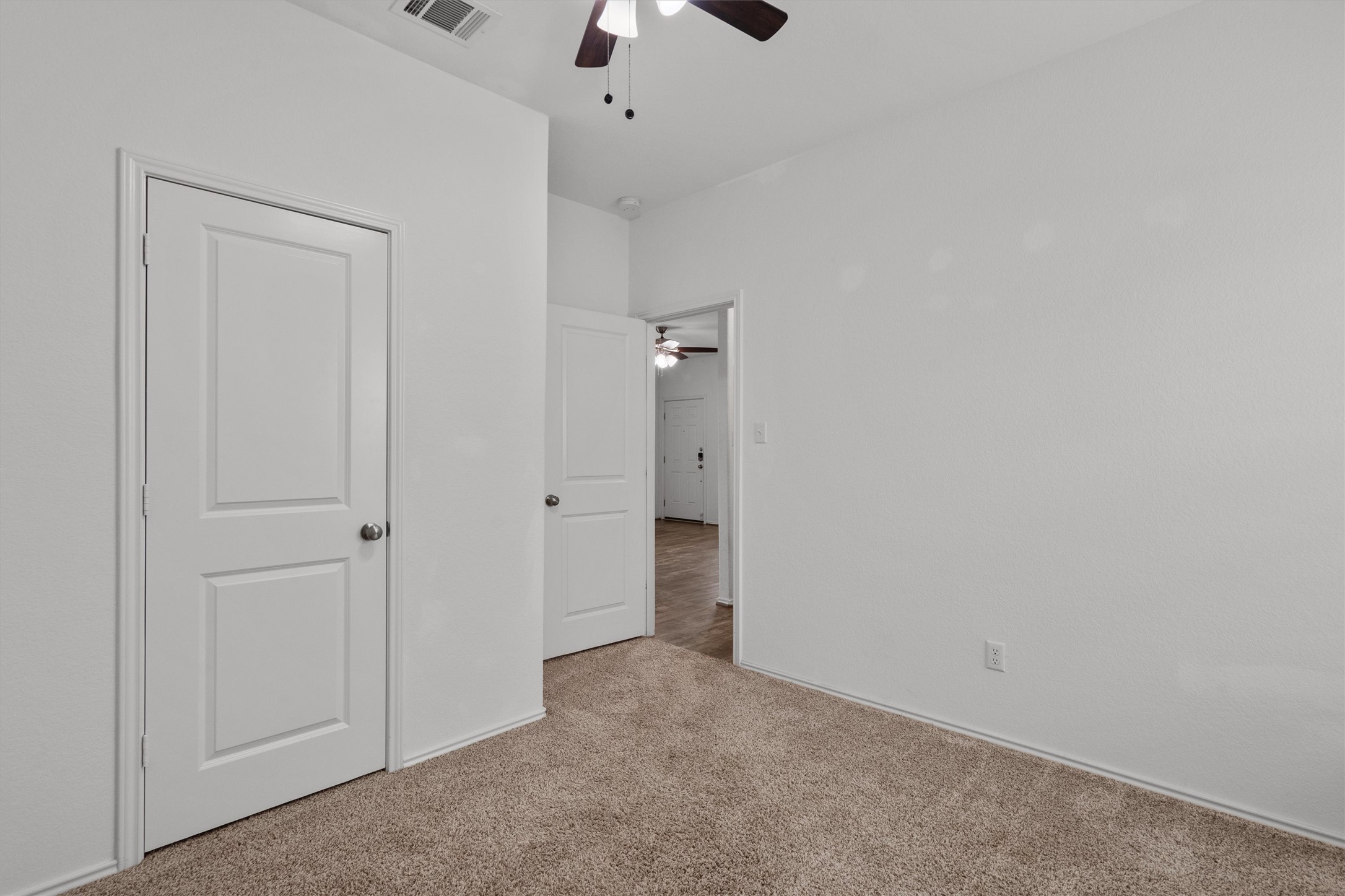 791 Circle Way Jarrell, TX 76537 - Photo 27 of 36 Neutral toned carpeting, white baseboards, and bright white walls