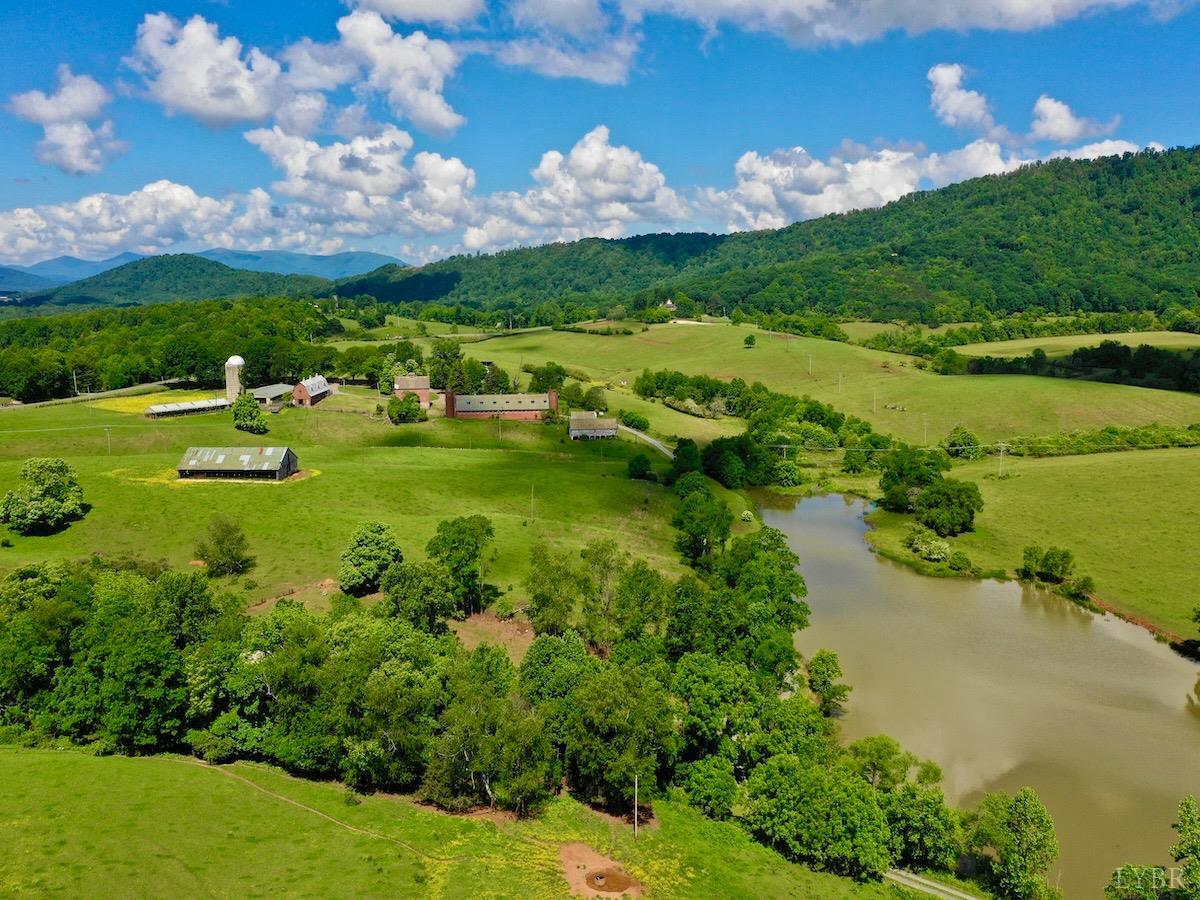127 Albert Farm Road Monroe, VA 24574 - Photo 1 of 98 a view of a lake with houses in the background