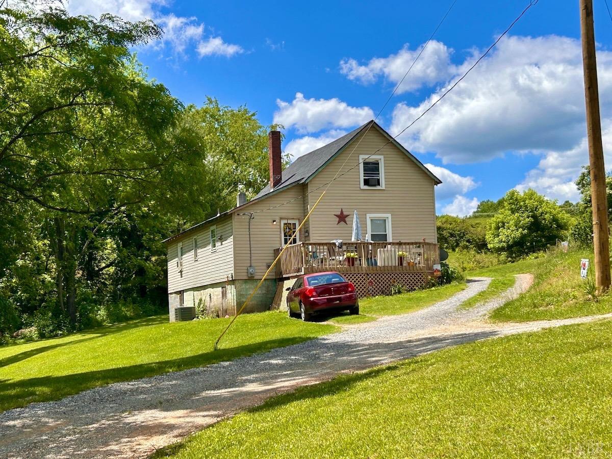 127 Albert Farm Road Monroe, VA 24574 - Photo 48 of 98 a front view of a house with a yard and garage