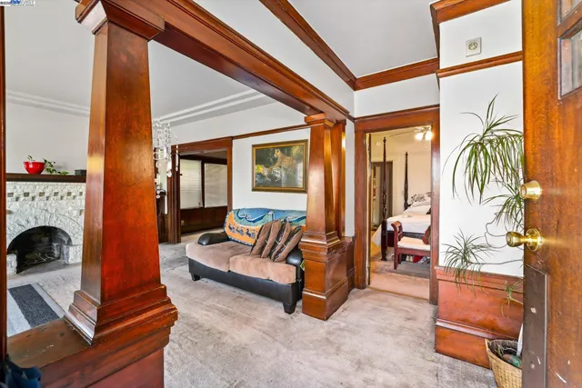 a living room with furniture a rug and a fireplace