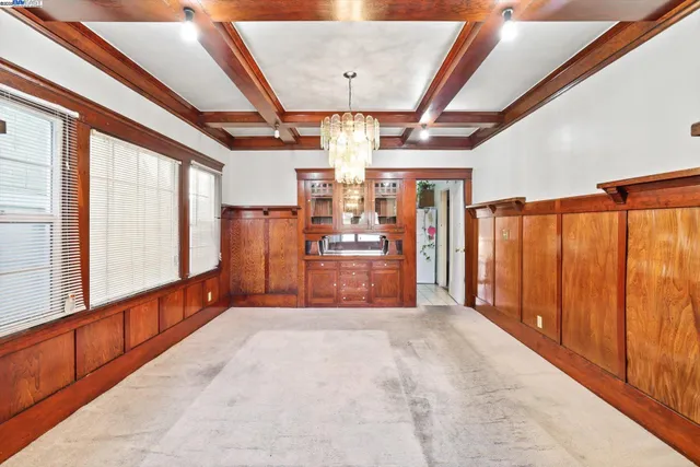 a large room with large windows and furniture