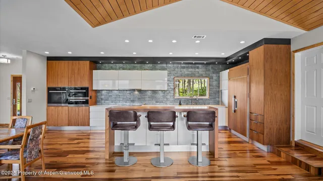a bathroom with a tub a sink and a shower