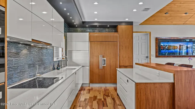 a view of a big room with table & chairs