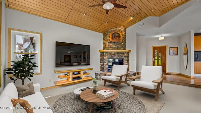 a bedroom with furniture and large windows