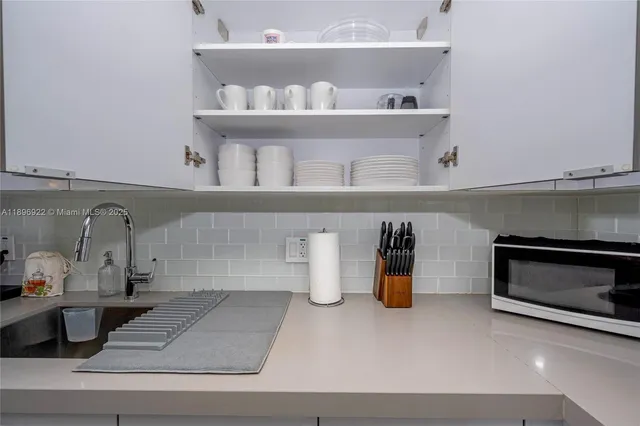 a kitchen with a oven and cabinets