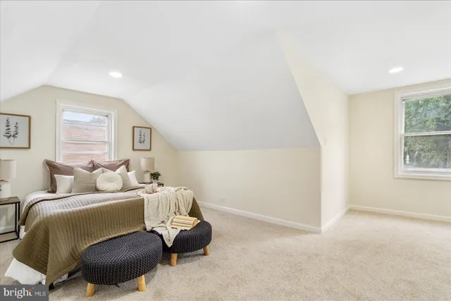 a room with a bed and a window