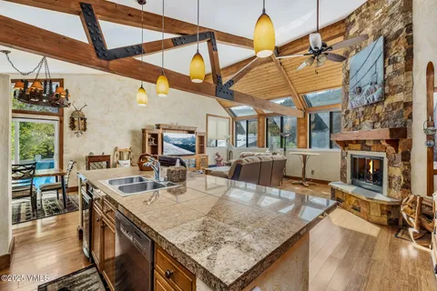 a kitchen with stainless steel appliances granite countertop a sink and cabinets
