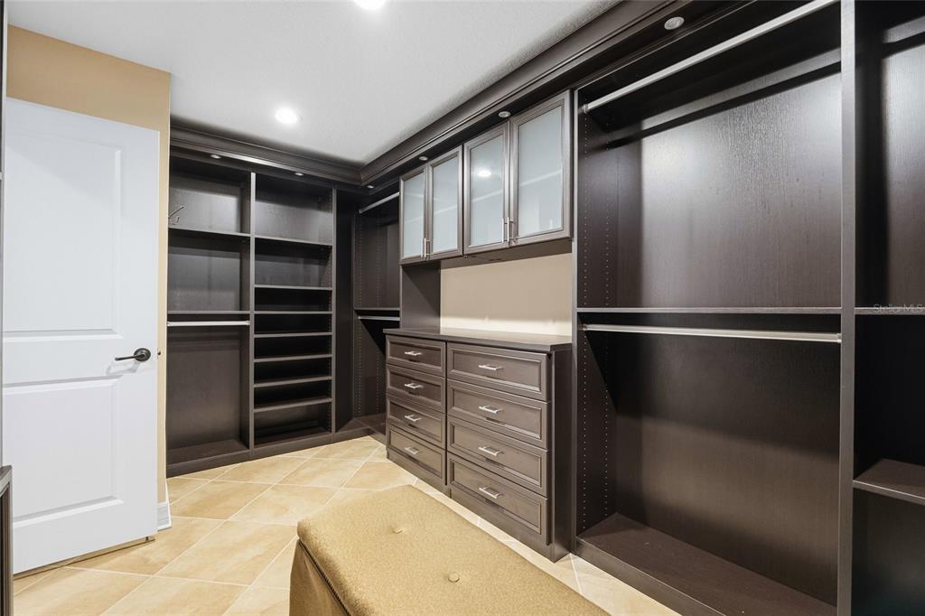 4527 Scarlet Loop Wesley Chapel, FL 33544 - Photo 15 of 57 a kitchen with a refrigerator and cabinets