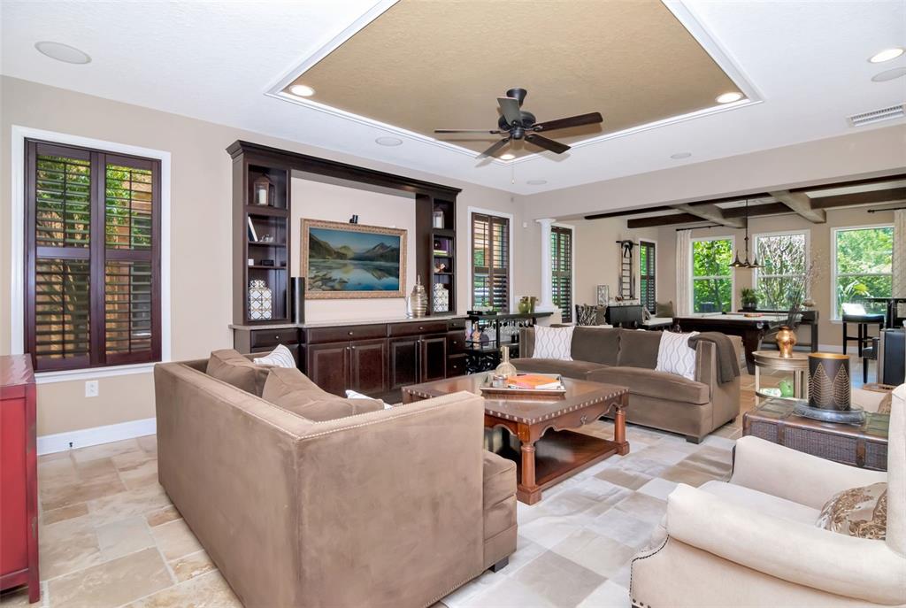 4527 Scarlet Loop Wesley Chapel, FL 33544 - Photo 17 of 57 a living room with furniture and a large window