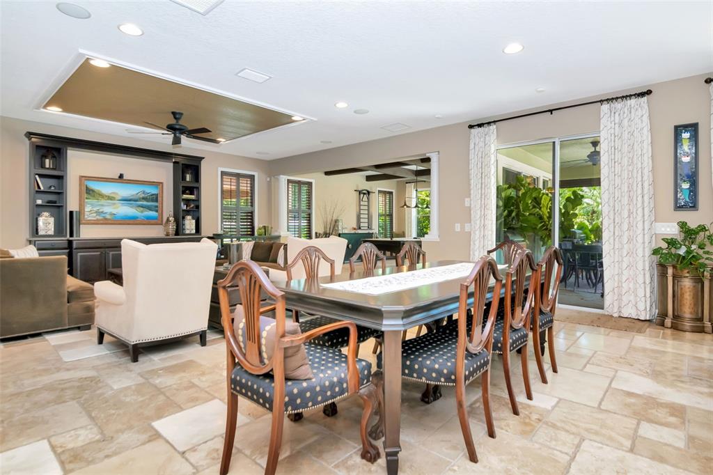 4527 Scarlet Loop Wesley Chapel, FL 33544 - Photo 23 of 57 a view of a dining room with furniture window and outside view