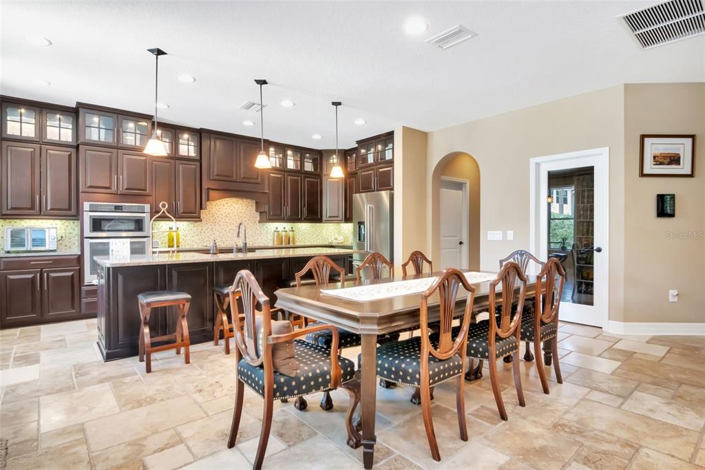 4527 Scarlet Loop Wesley Chapel, FL 33544 - Photo 25 of 57 a view of a dining area with furniture