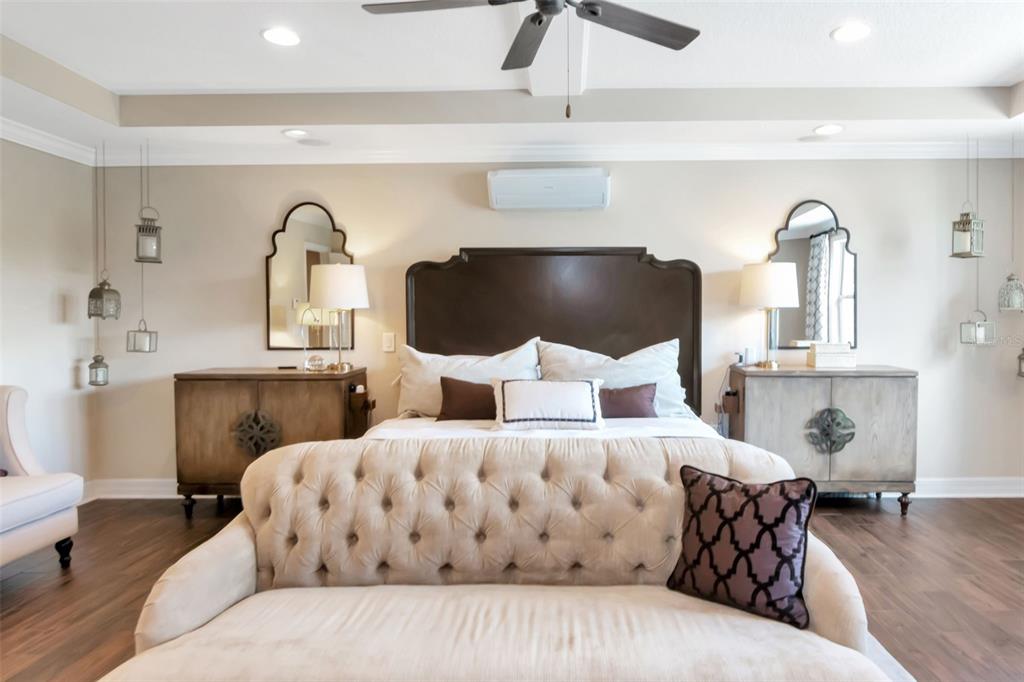 4527 Scarlet Loop Wesley Chapel, FL 33544 - Photo 29 of 57 a bedroom with a bed and wooden floor