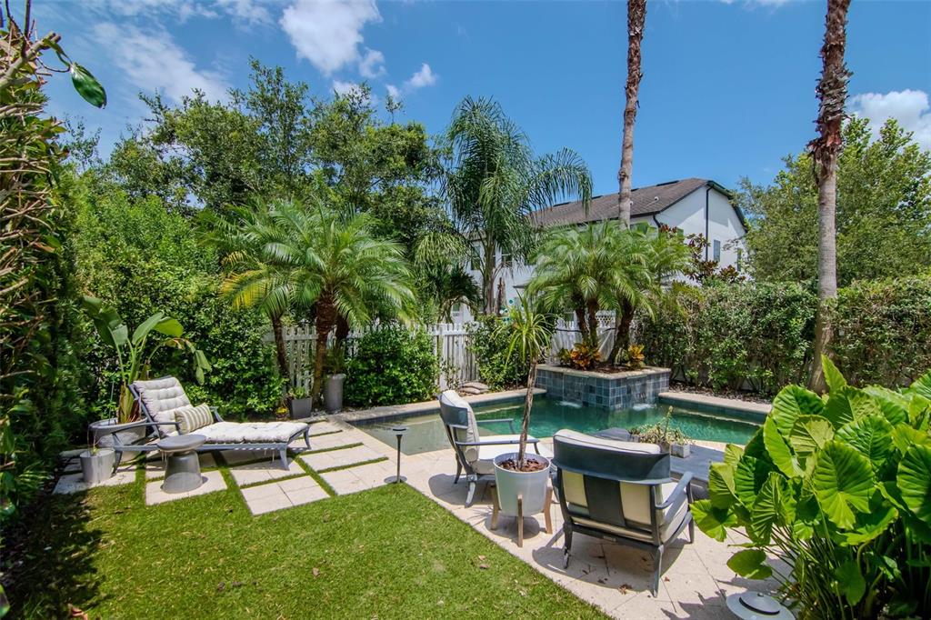 4527 Scarlet Loop Wesley Chapel, FL 33544 - Photo 45 of 57 a view of a sitting area with furniture and garden