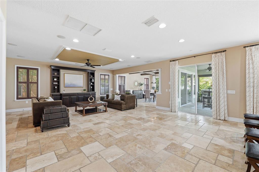 4527 Scarlet Loop Wesley Chapel, FL 33544 - Photo 7 of 57 a living room with furniture large window and flat screen tv