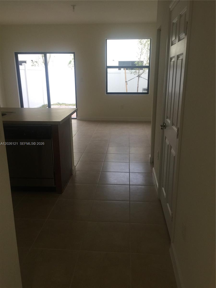 9307 West 33rd Way Hialeah, FL 33018 - Photo 5 of 23 a view of an empty room with a window