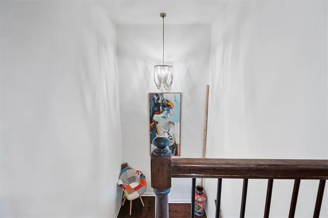 a view of a hallway with furniture and front door