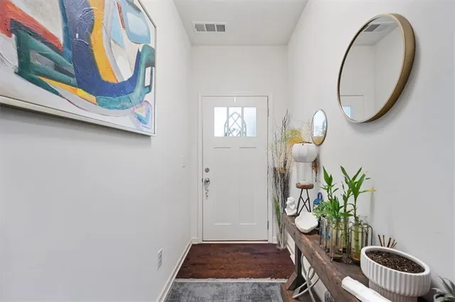 a front view of a house with garden and entryway
