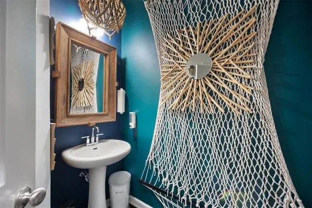 a bathroom with a sink and mirror