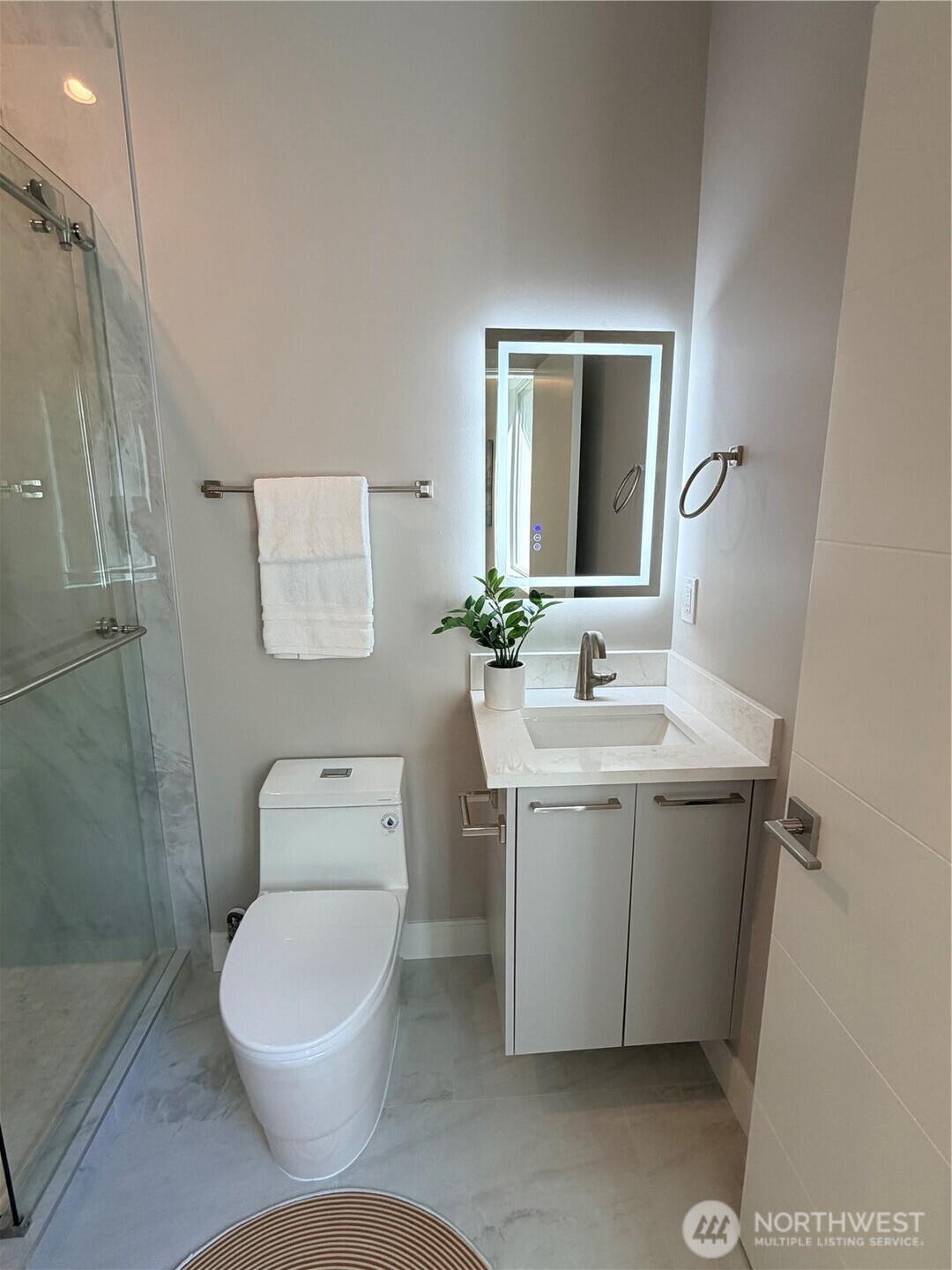 4305 Northeast 26th Court Renton, WA 98059 - Photo 16 of 40 a bathroom with a toilet sink and mirror