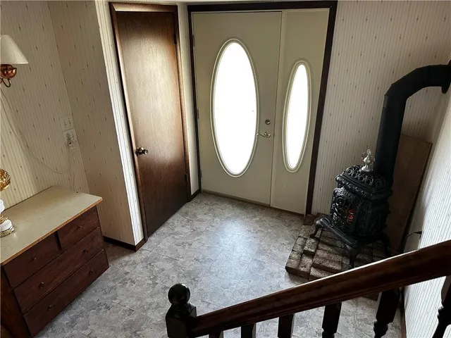 a view of a livingroom with furniture and front door