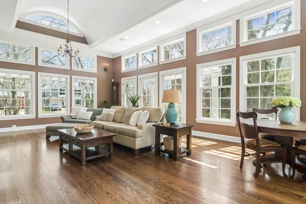 a kitchen with a sink cabinets and wooden floor