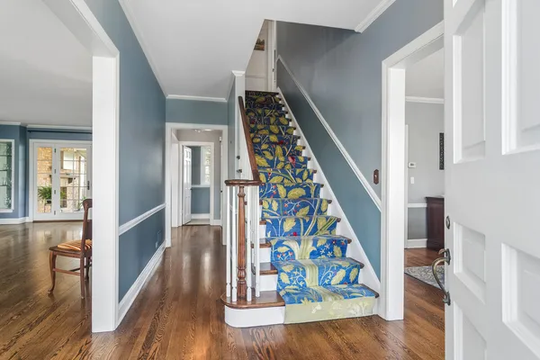 wooden floor with an entryway and wooden floor