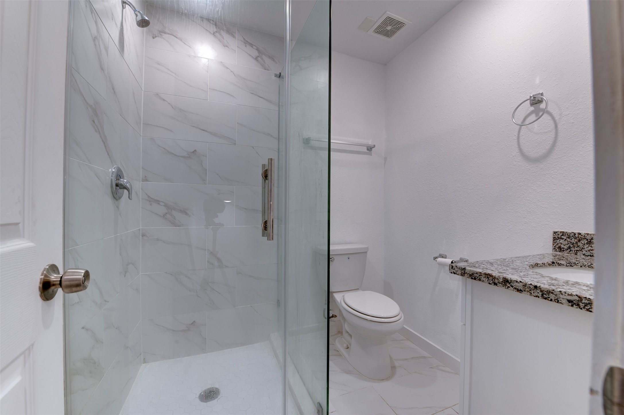 6309 Sandra Street, Unit B/2 Houston, TX 77028 - Photo 16 of 23 a bathroom with a granite countertop sink a toilet and shower