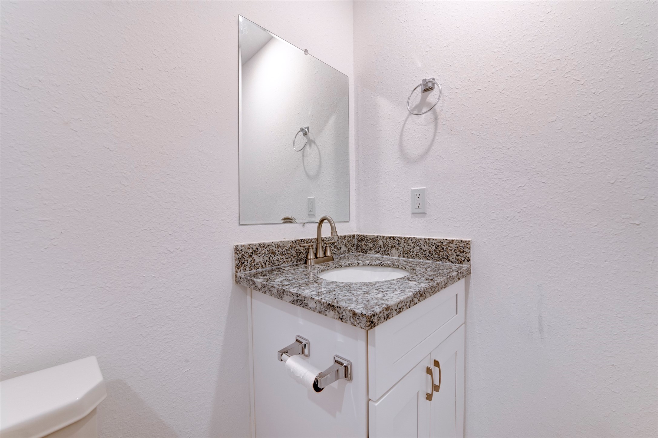 6309 Sandra Street, Unit B/2 Houston, TX 77028 - Photo 23 of 23 a bathroom with a granite countertop sink and a mirror