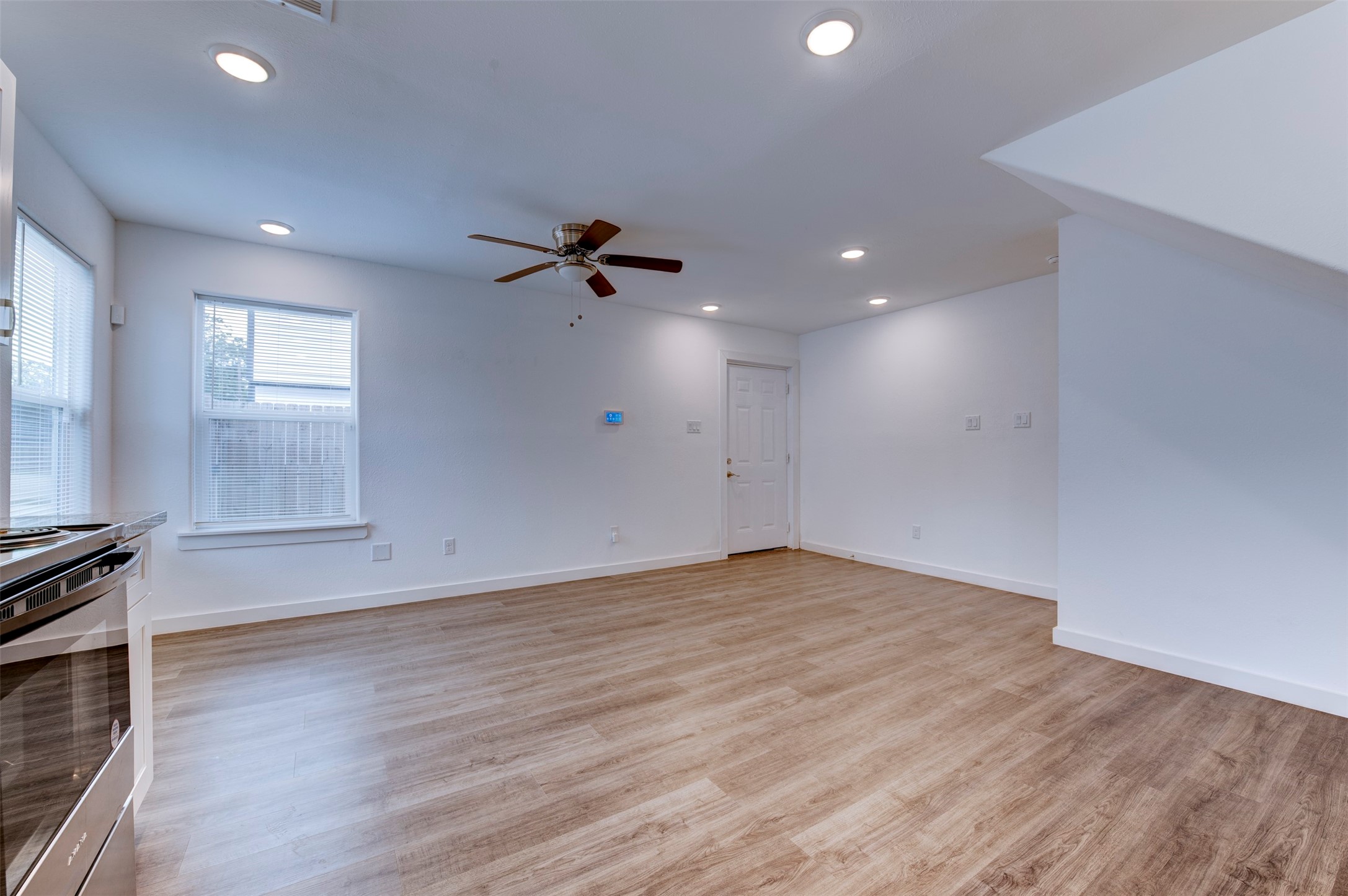 6309 Sandra Street, Unit B/2 Houston, TX 77028 - Photo 9 of 23 a view of empty room with wooden floor and fan