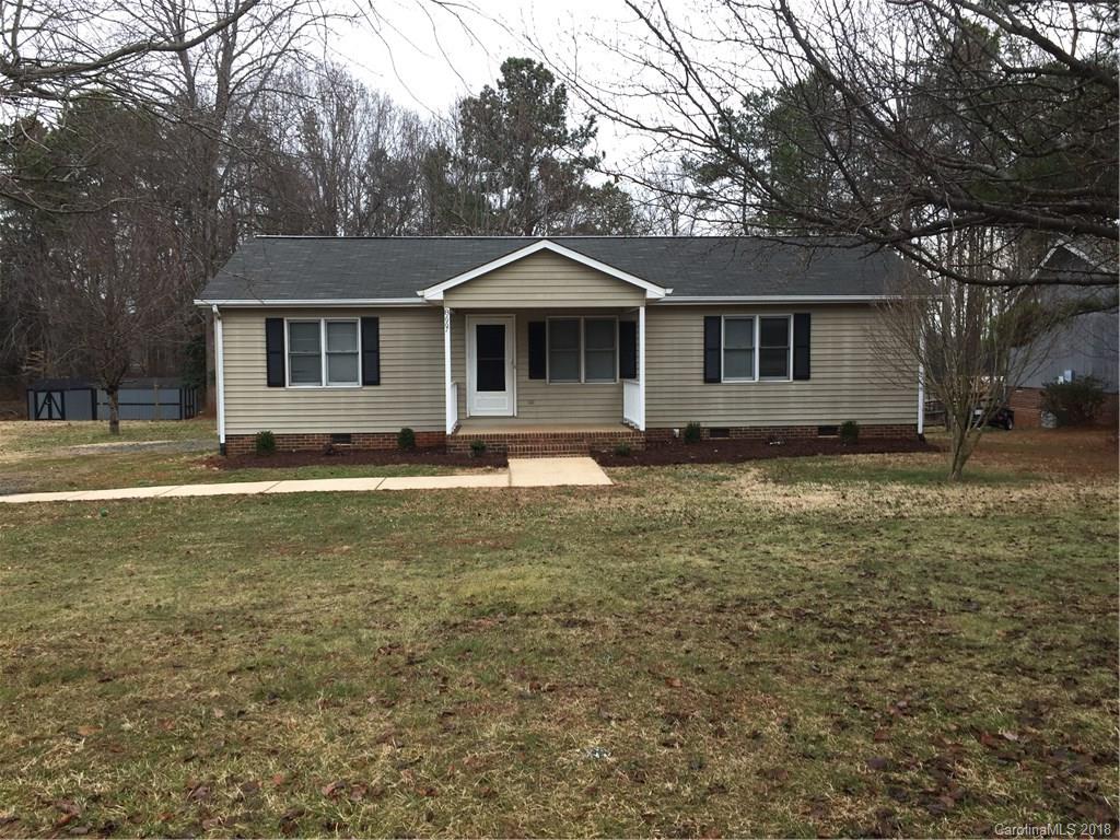 8667 Unity Church Road Denver, NC 28037 - Photo 1 of 23 a front view of a house with a yard