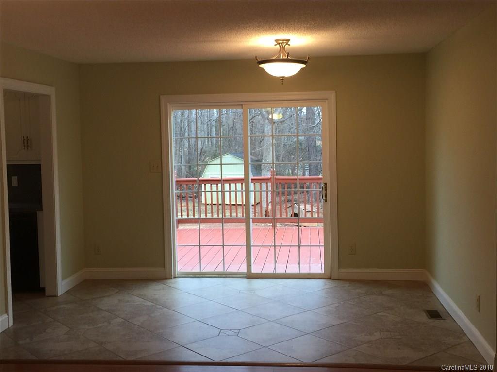 8667 Unity Church Road Denver, NC 28037 - Photo 4 of 23 an empty room with a window