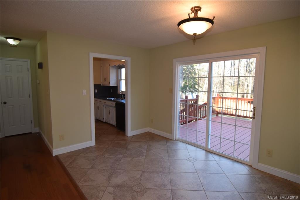 8667 Unity Church Road Denver, NC 28037 - Photo 10 of 23 wooden floor in an empty room with a window